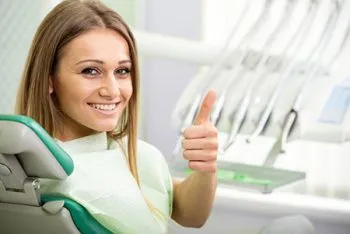 smiling woman in dental chair
